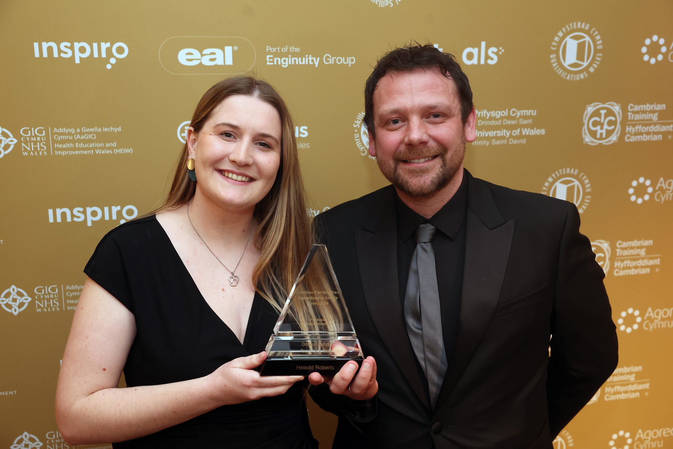Heledd Roberts recieving her award from judge for the Tomorrow's Talent Award at the 2024 Apprenticeship awards Cymru